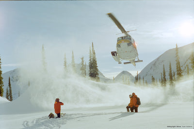 Helicopter landing in snow with skiers, sample shot on CineStill 50D