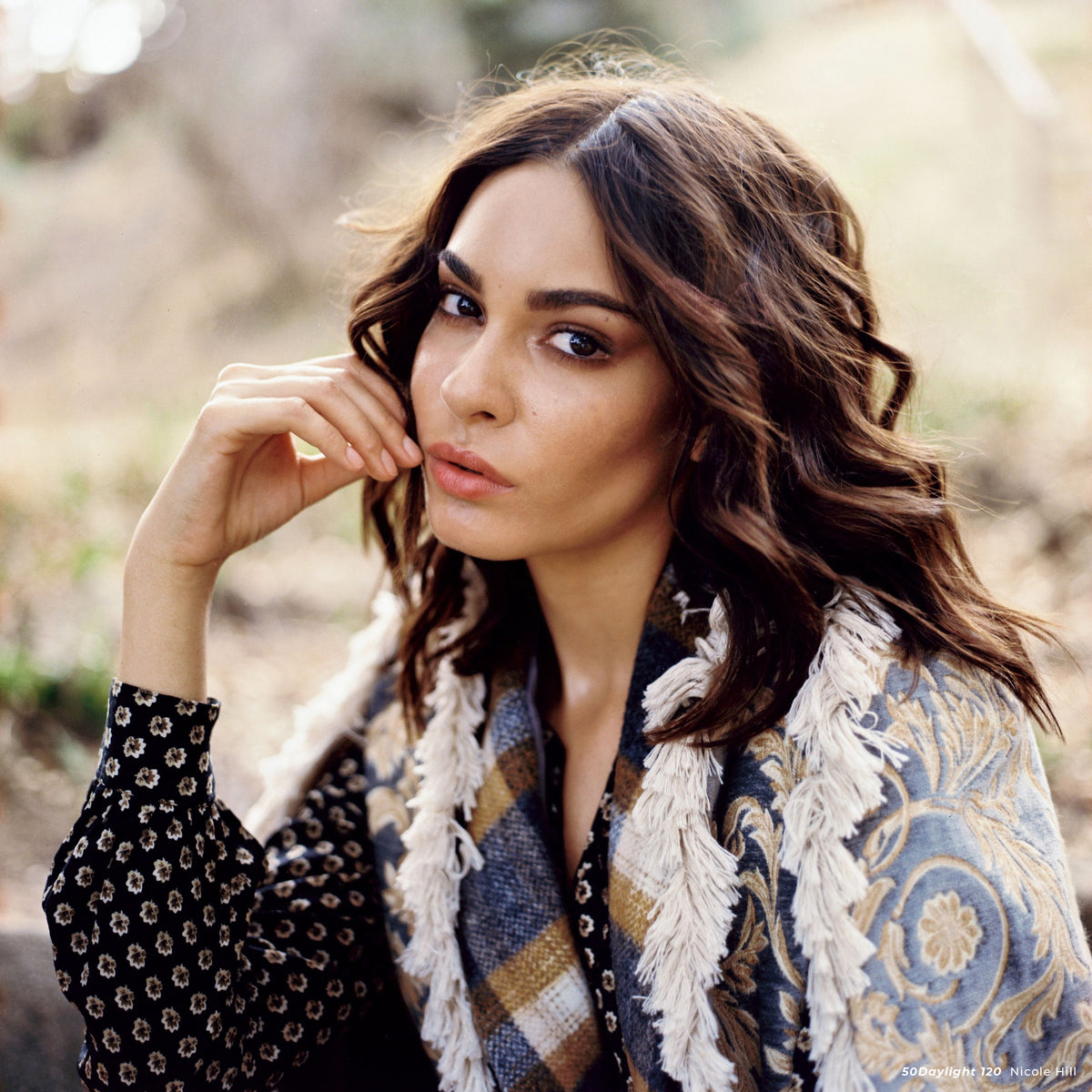 Portrait of a woman with wavy hair in a fringed shawl, sample shot on CineStill 50D 120