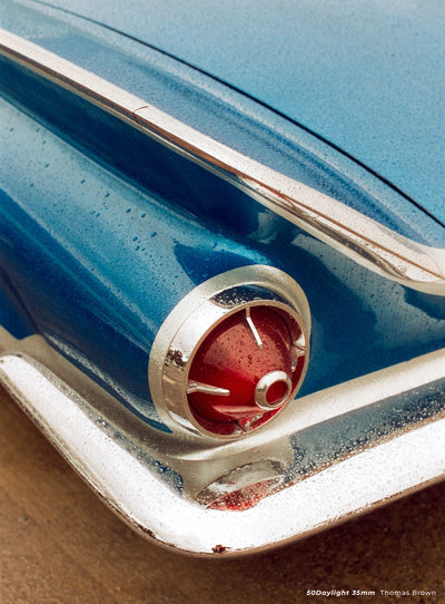 Blue classic car tail light with raindrops, sample shot on CineStill 50D