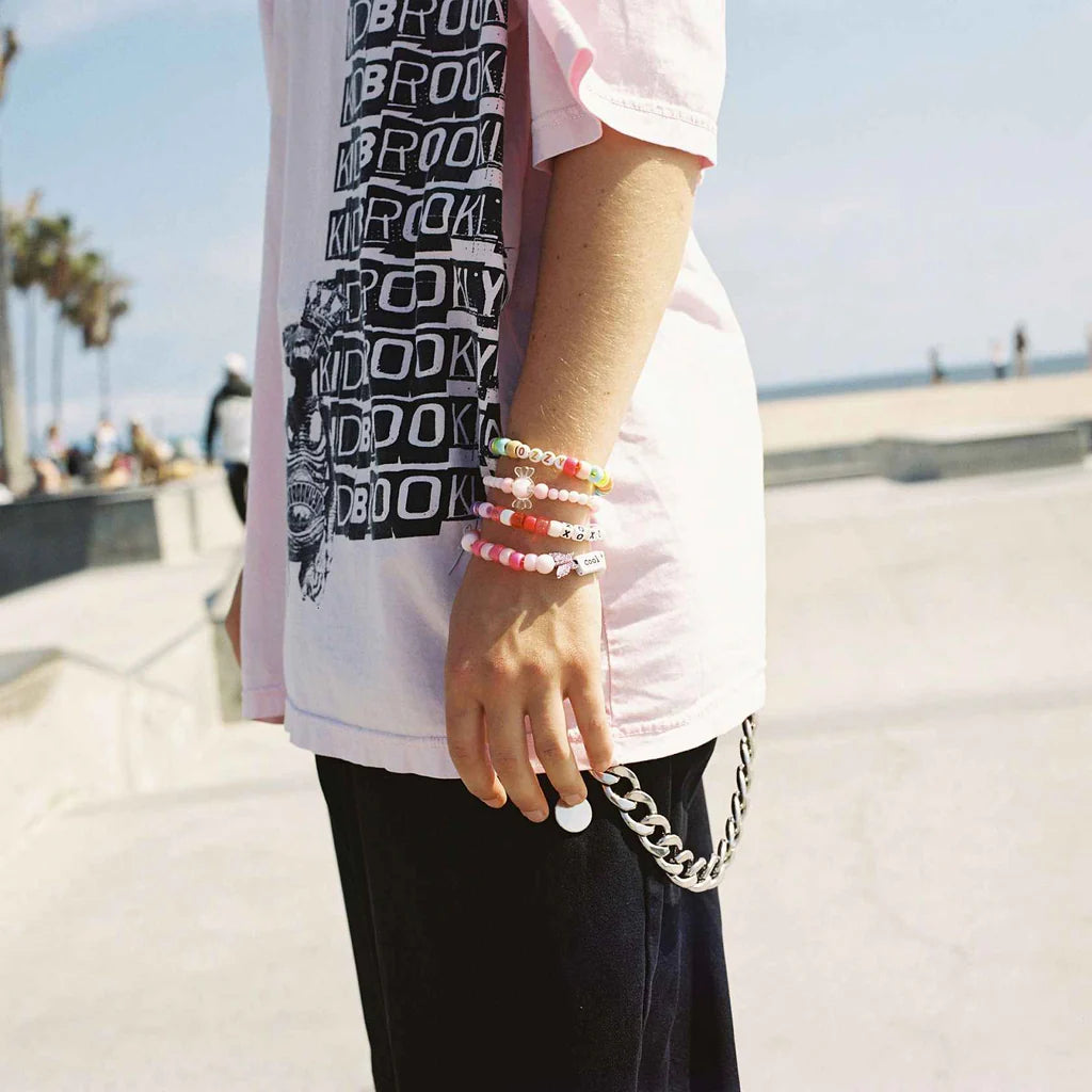 Person with beaded bracelets at a skate park, sample shot on Kodak Ektacolor Pro 400