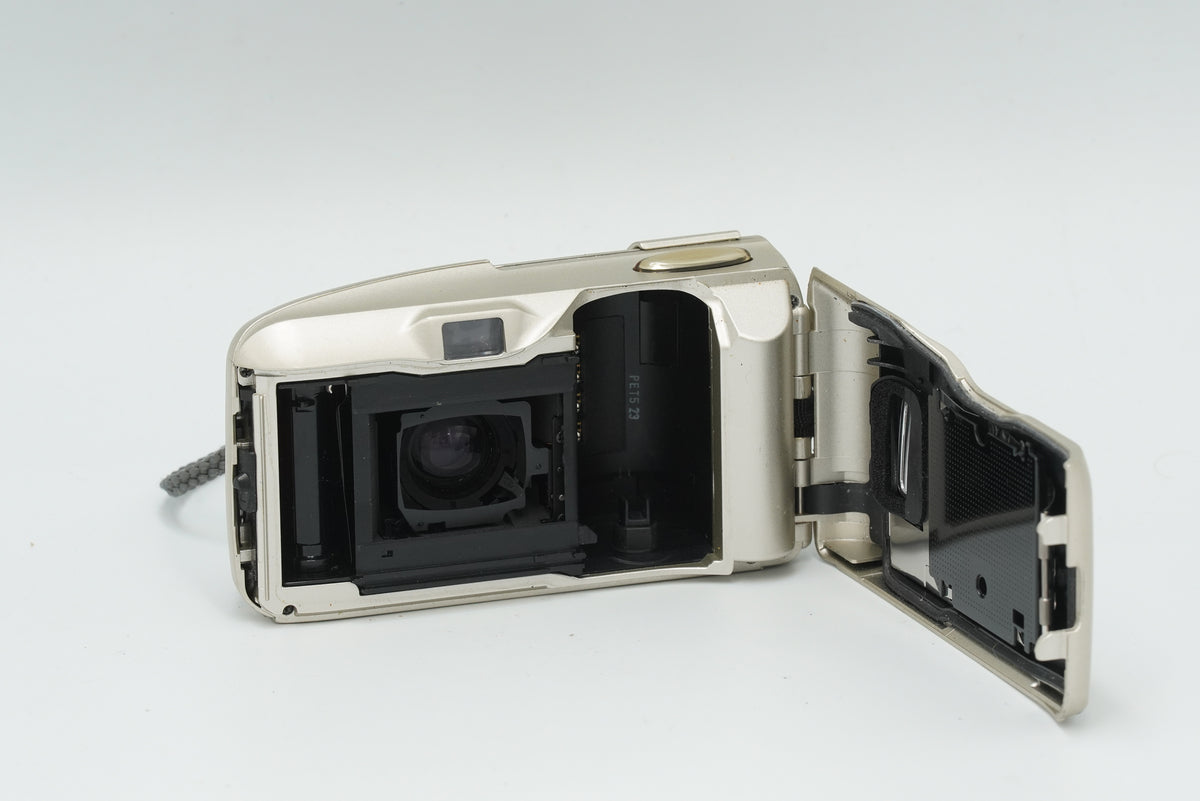 Olympus Mju-II film camera with the back open, showing the film chamber