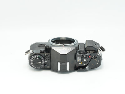 Canon A-1 black SLR, top view with shutter dial and AE mode dial