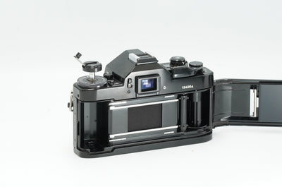 Canon A-1 with the back open, showing the film chamber and pressure plate