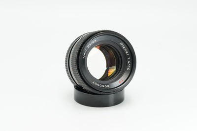 Carl Zeiss Planar 50mm f/1.4 Contax AEJ lens, front three-quarter view