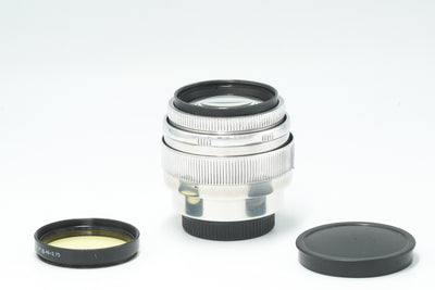 Jupiter-9 85mm f/2 silver lens with yellow filter, cap and rear cap