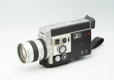 Canon Auto Zoom 814 Electronic Super 8 movie camera with zoom lens and hand strap