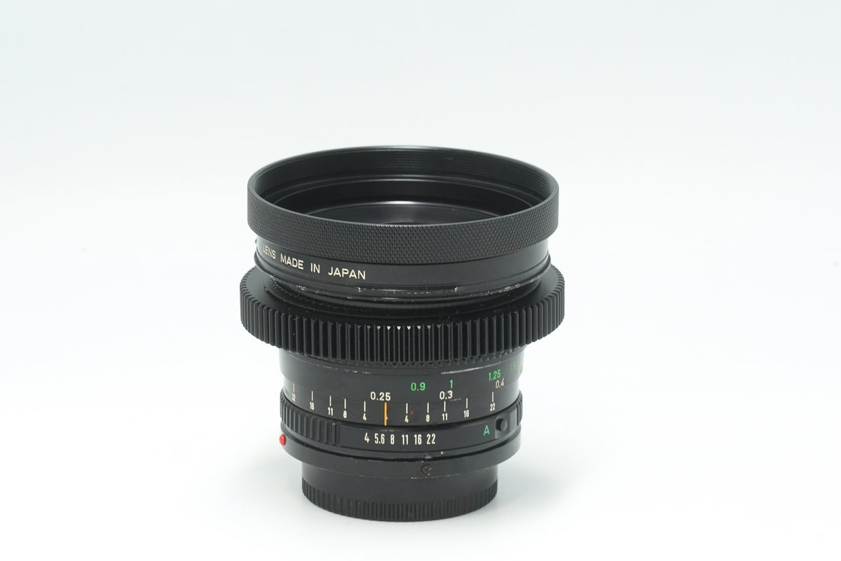 Canon nFD 17mm f/4 cine-modded with focus gear and metal hood