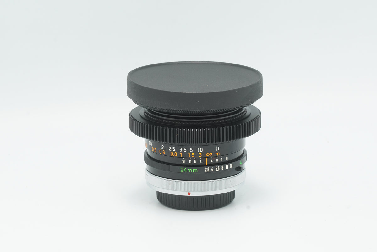 Canon FD 24mm f/2.8 S.S.C. cine-modded with focus gear and slip-on front cap