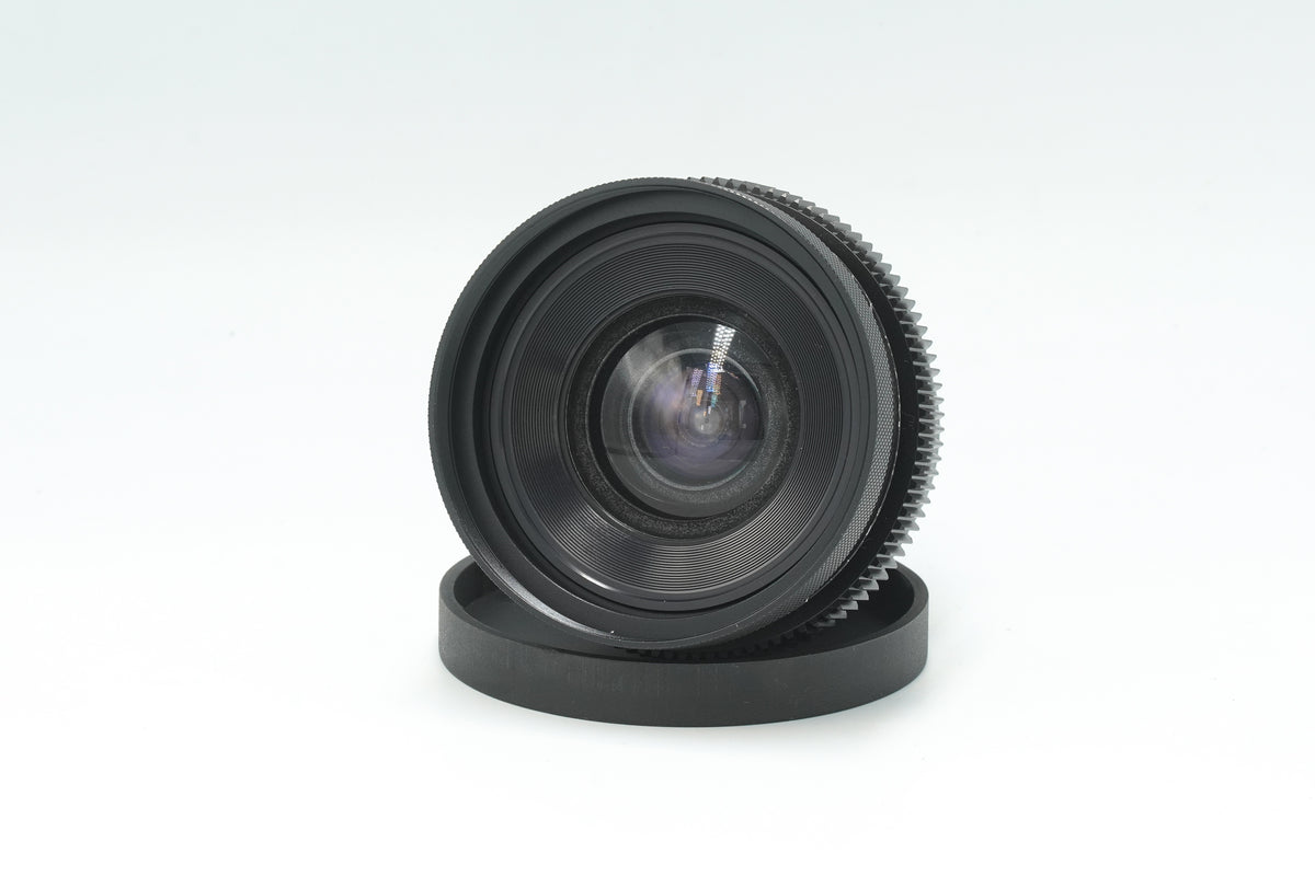 Canon nFD 17mm f/4 cine mod, front angle view with rear cap
