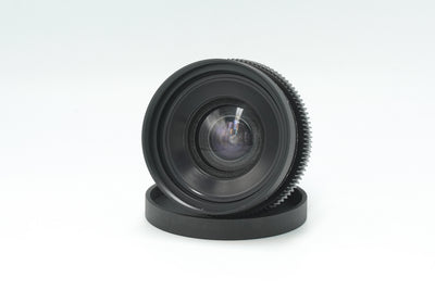 Canon nFD 17mm f/4 cine mod, front angle view with rear cap