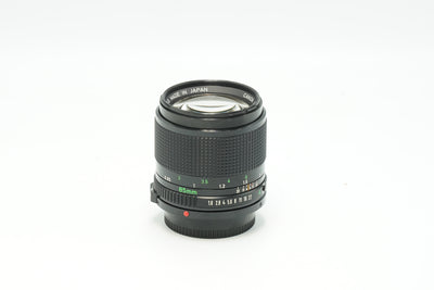 Canon New FD 85mm f/1.8 portrait lens, side view with focus scale