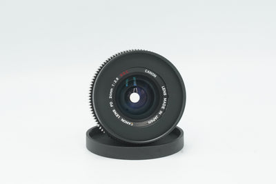 Canon FD 24mm f/2.8 S.S.C. cine mod, front view with focus gear