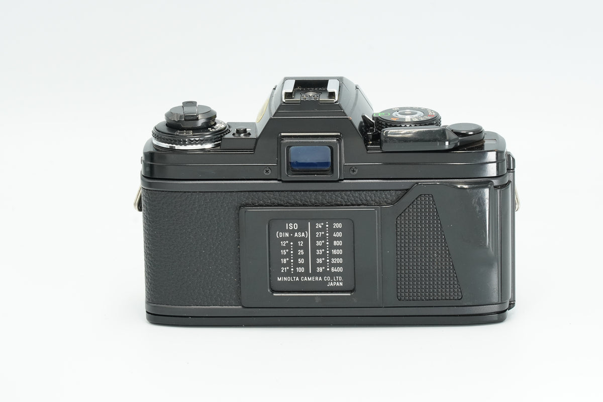 Minolta X-700 black film camera, rear view with ISO table