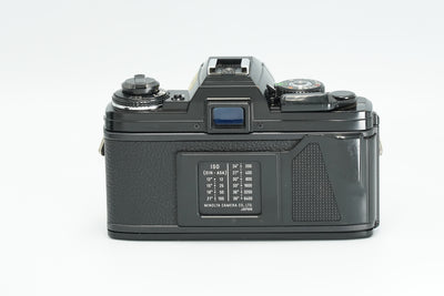 Minolta X-700 black film camera, rear view with ISO table