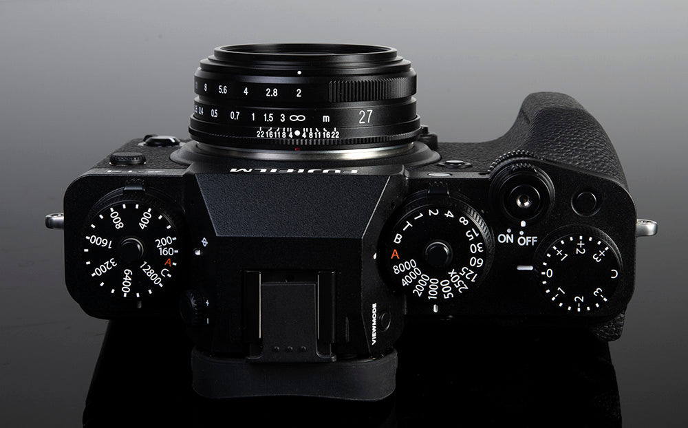 Black Fujifilm X camera with the Voigtlander Ultron 27mm f/2, top view