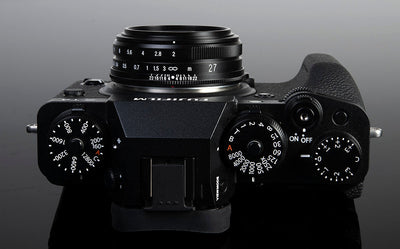 Black Fujifilm X camera with the Voigtlander Ultron 27mm f/2, top view