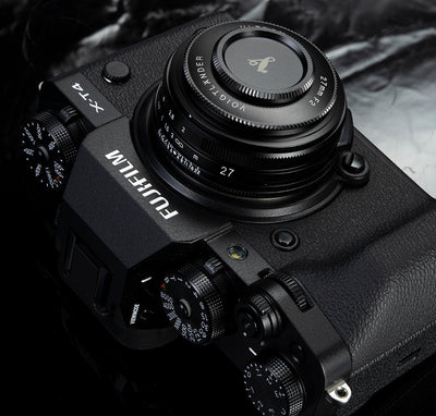 Voigtlander Ultron 27mm f/2 pancake on a black Fujifilm X-T4 with lens cap