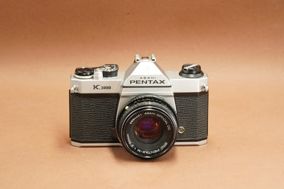 Pentax K1000 with SMC Pentax-M 50mm f/2 lens, front view