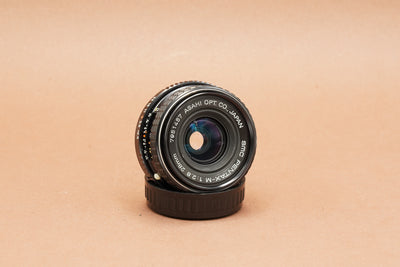 SMC Pentax-M 28mm f/2.8, front three-quarter view