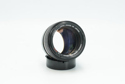 Canon FD 85mm f/1.8 S.S.C. portrait lens, angled view of the front element