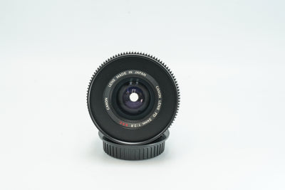 Canon FD 24mm f/2.8 cine-modded lens, front element and name ring