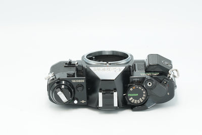 Canon AE-1 Program black, top view with Program dial and film advance lever