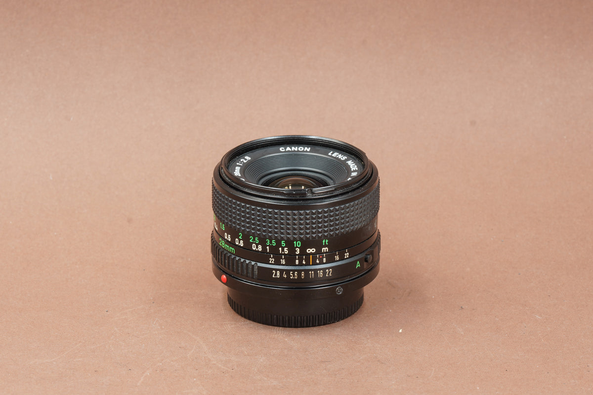 Canon nFD 28mm f/2.8, side view with focus and aperture scales