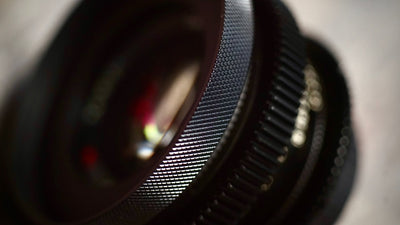 SIMMOD front cine ring fitted to a lens with follow focus gear, close-up