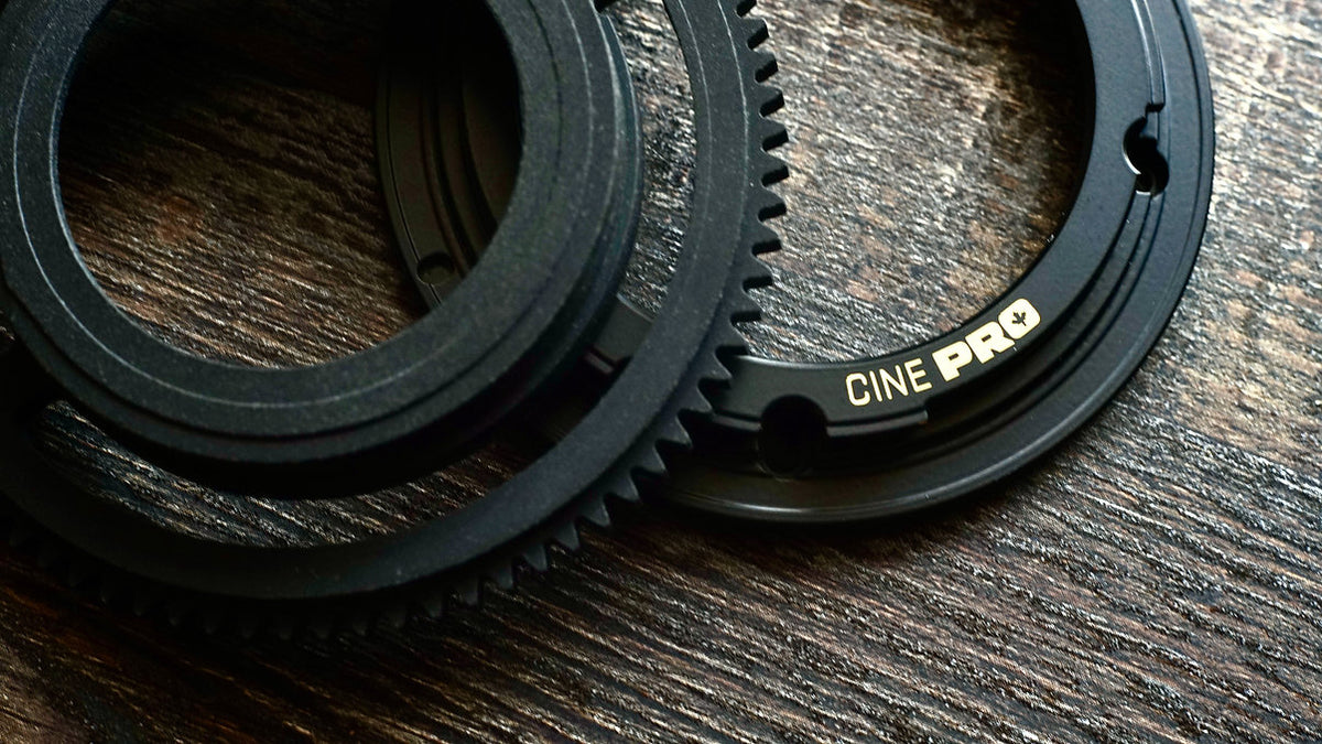 SIMMOD Cine Pro EF mount and declicked gear ring on a wooden table