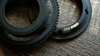 SIMMOD Cine Pro EF mount and declicked gear ring on a wooden table
