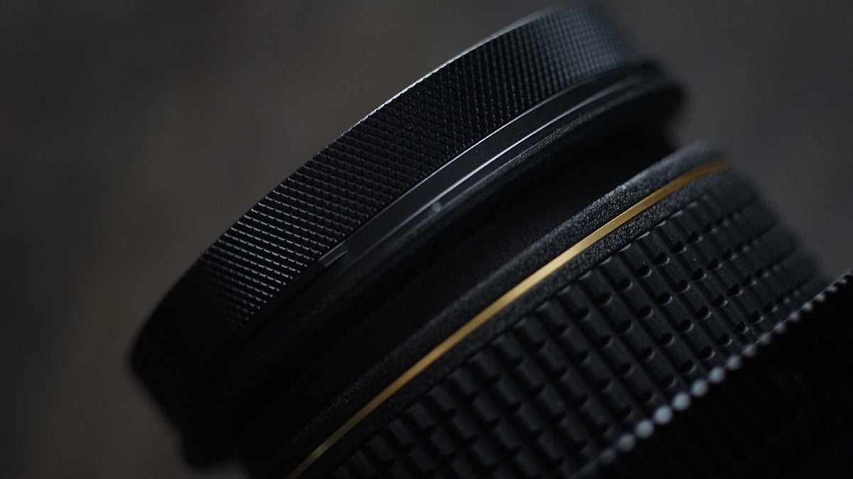 SIMMOD knurled front cine ring on a lens barrel, close-up