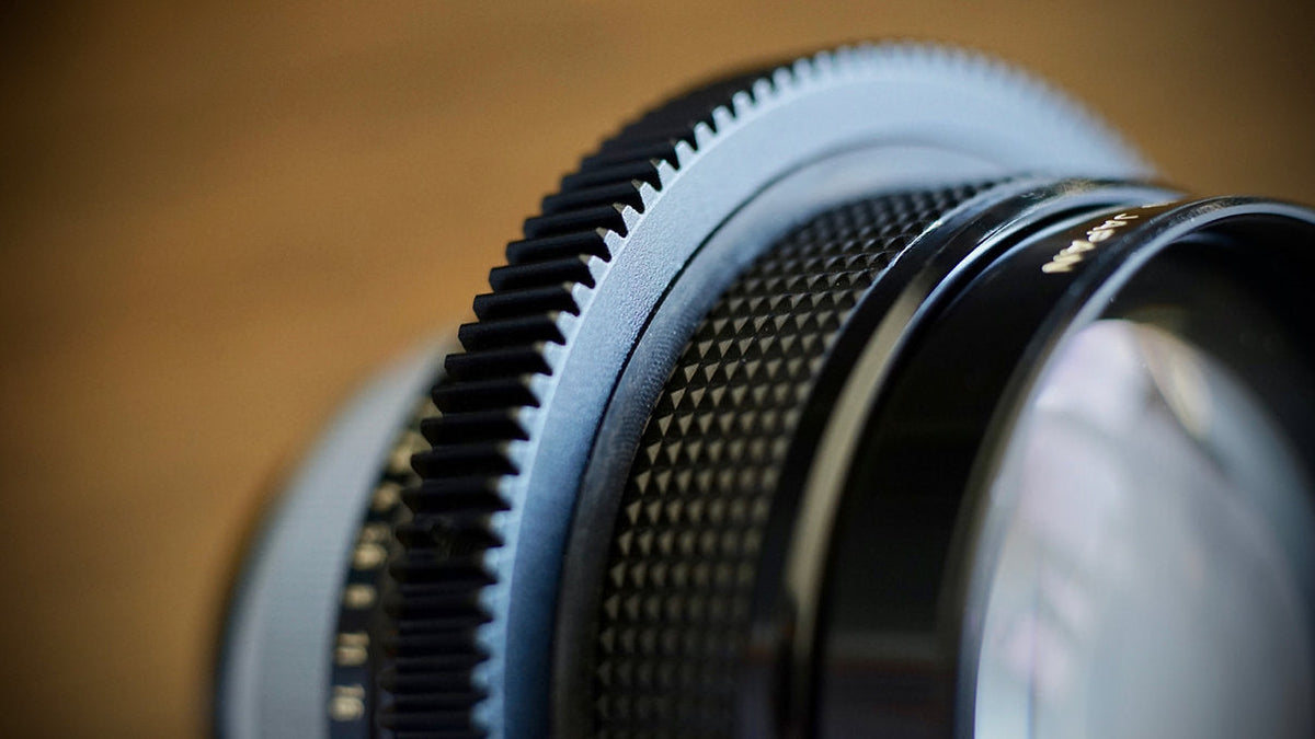 SIMMOD follow focus gear fitted to a vintage lens, close-up of the gear teeth