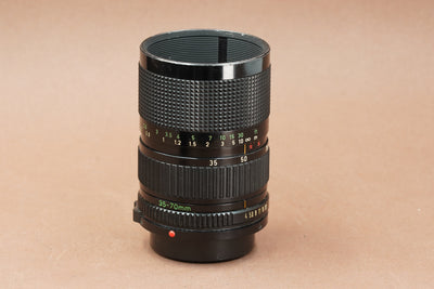 Canon New FD 35-70mm f/4 zoom lens, side view with focus and zoom scales