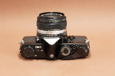 Olympus OM-1 black SLR top plate with film rewind and ON/OFF switch