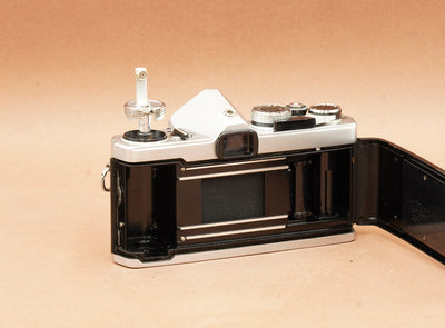 Olympus OM-1 with the back open, showing the film chamber